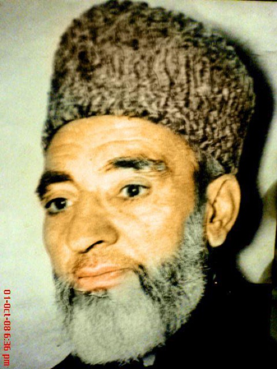 Close portrait of Hazrat Zia Jaffry (R.A.) wearing a karakul cap